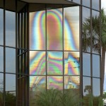**FILE** People gather to view an image that looks like the Virgin Mary on the windows of a building in Clearwater, Fla., in this March 29, 1997, file photo. The windows that thousands of visitors believed bore the image of the Virgin Mary were discovered broken Monday, March 1, 2004, police said. The three top panes that showed what appeared to be the Virgin Mary's veiled head were destroyed, with just shards of glass remaining in the window frames. The image first appeared a week before Christmas in 1996. (AP Photo/Peter Cosgrove, File)