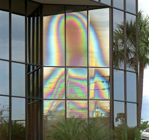**FILE** People gather to view an image that looks like the Virgin Mary on the windows of a building in Clearwater, Fla., in this March 29, 1997, file photo. The windows that thousands of visitors believed bore the image of the Virgin Mary were discovered broken Monday, March 1, 2004, police said. The three top panes that showed what appeared to be the Virgin Mary's veiled head were destroyed, with just shards of glass remaining in the window frames. The image first appeared a week before Christmas in 1996. (AP Photo/Peter Cosgrove, File)